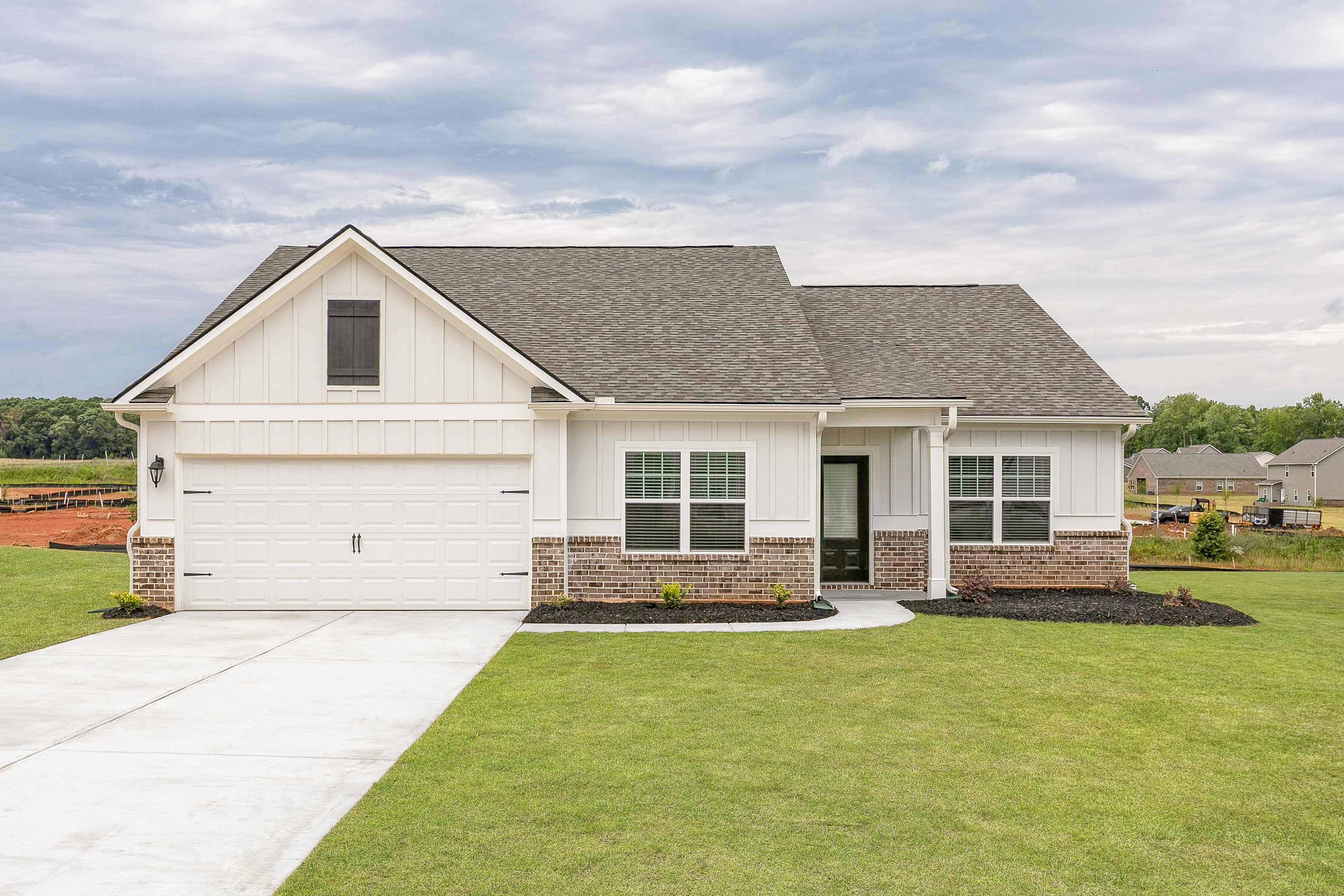 The Dockery at LGI Homes boasts a gorgeous exterior and professional front yard landscaping.