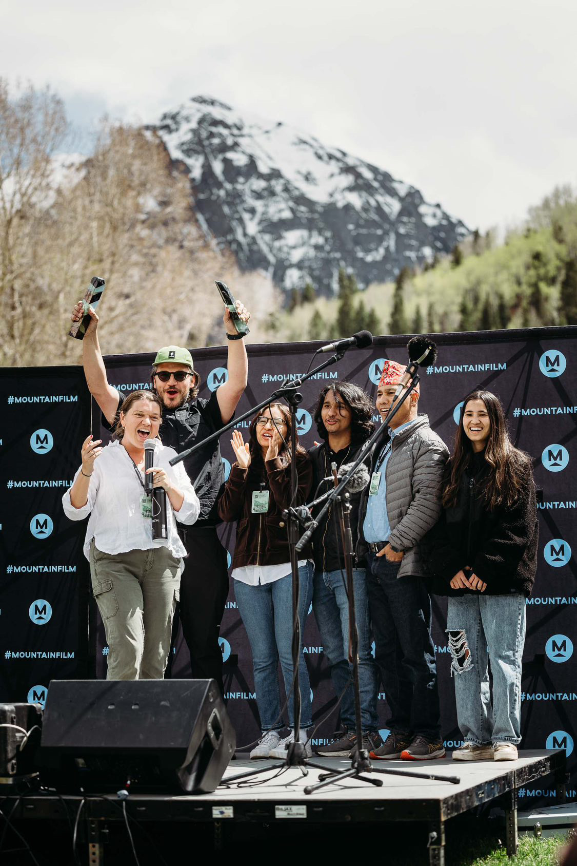 Maggie Doyne, Jeremy Power Regimbal, Kopila Valley graduates Shova and Bivek, Tope Bahadur Malla, and Kopila Valley graduate Kalpana celebrate after winning the Audience Award and Student Choice Award at Mountainfilm festival in May. Photo credit: Ben Eng Photography.