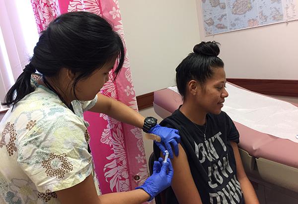 A patient receives a hepatitis B vaccination through the Kokua Kalihi Valley Comprehensive Family Services project.