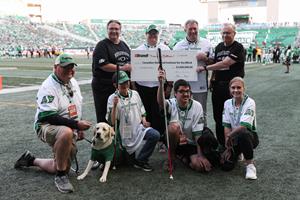 Brandt’s CEO and Chairman present a cheque to CNIB’s President & CEO and Vice President of Western Canada.