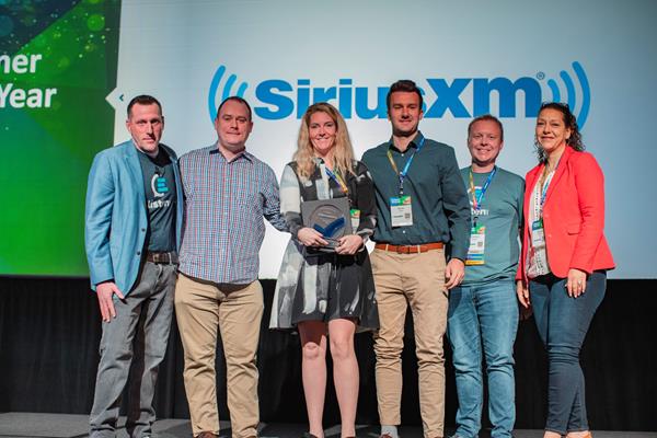 VP of Product Bruce McMahon announced SiriusXM as CallMiner's Customer of the Year at the annual LISTEN conference.