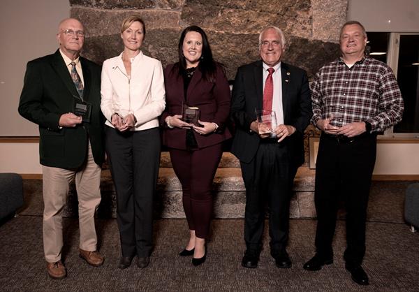 Five individuals were honored at this year's Husson University Alumni Hall of Fame ceremony. They included (from left to right): Larry Homsted, Class of 1964; Karen F. Clements, RN, Class of 2004 Graduate School; Michelle Osgood Montgomery, DO, Class of 2011; Dewey Martin, Honorary Alumnus Class of 2019; and Albert W. Allen, Class of 1986.  

Plaques honoring this year’s Alumni Hall of Fame recipients will be displayed prominently, along with plaques of other past honorees, in a hallway adjacent to the Campus Center on the ground floor of Peabody Hall on Husson University’s campus in Bangor, Maine. This hall features every Alumni Hall of Fame recipient since the award’s inception.   