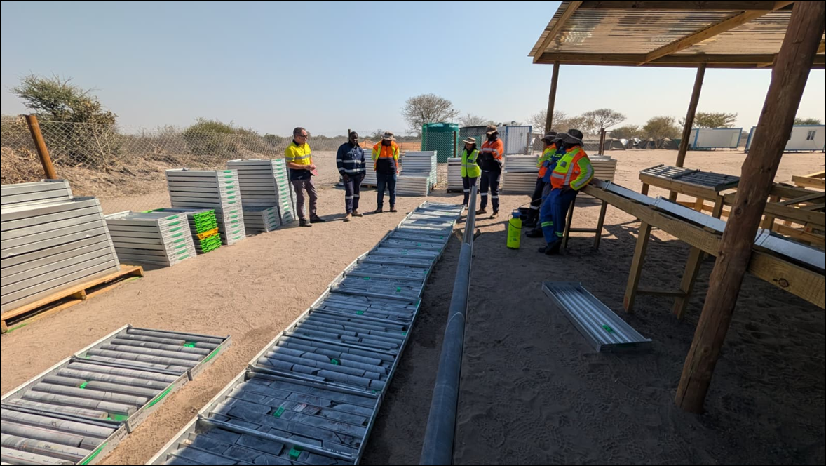 Figure 3: Core yard and geological team at Leviathan's Central Project; Mitchell Drilling camp operations in background.