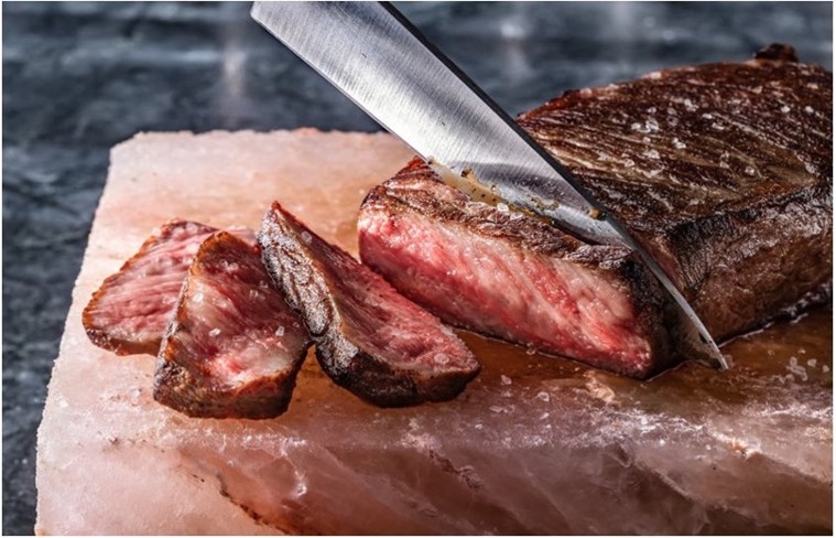 Guests can enhance their experience with a 20 oz. Wagyu New York Strip, renowned for intense marbling and buttery texture.