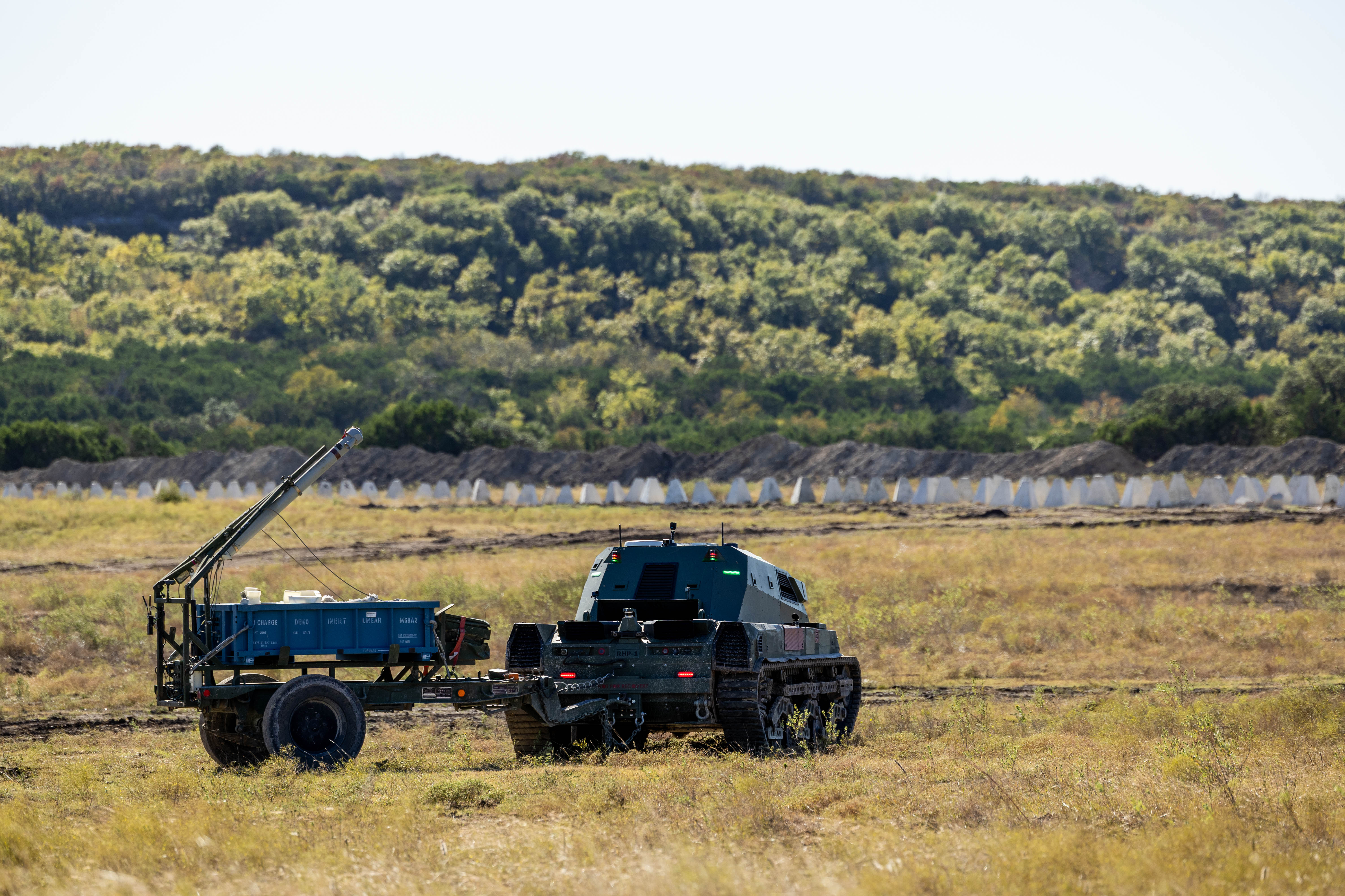 Textron M5 autonomously maneuvers to the forward line in preparation to deploy M58 Mine Clearing Line Charge (MCLIC) as part of breaching operations at Fort Hood, Texas.