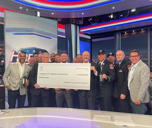 Multi-Weight UFC Champion & Proper No. Twelve Founder Conor McGregor presents a $1 million check to Tunnel to Towers Foundation Chairman & CEO Frank Siller