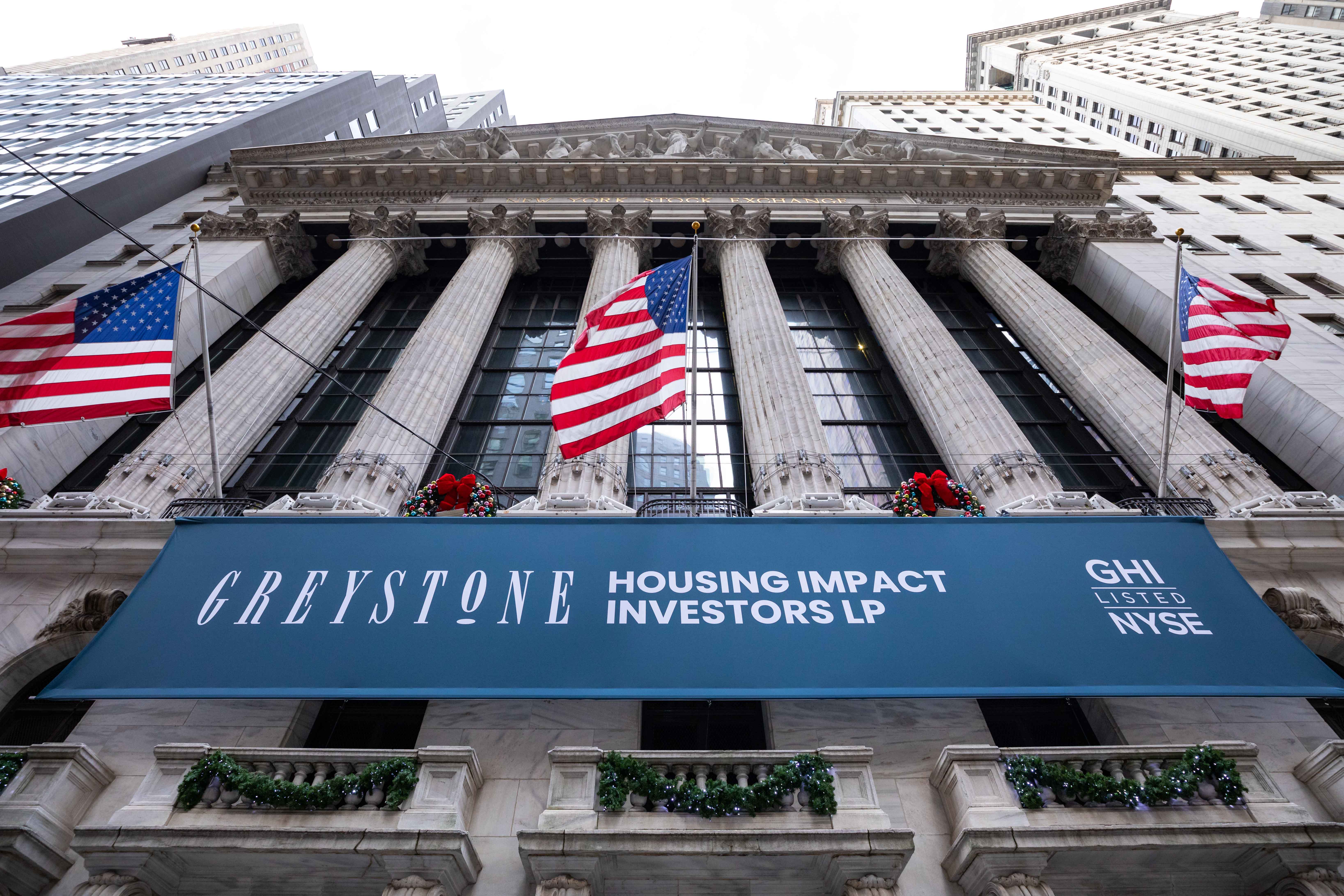 Greystone Housing Impact Investors LP rings the opening bell on NYSE on December 12, 2022.
