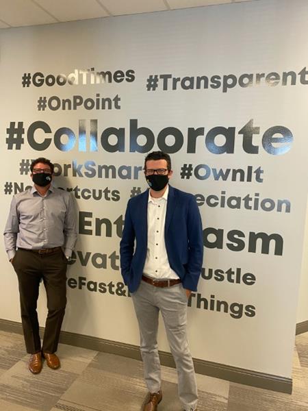 While the GrantMatch team continues to work remotely during the COVID-19 pandemic, 
Managing Partners Dan Civiero, (left), and Mike Janke are pictured here 
in front of the GrantMatch culture wall at the firm’s head office during a recent visit

