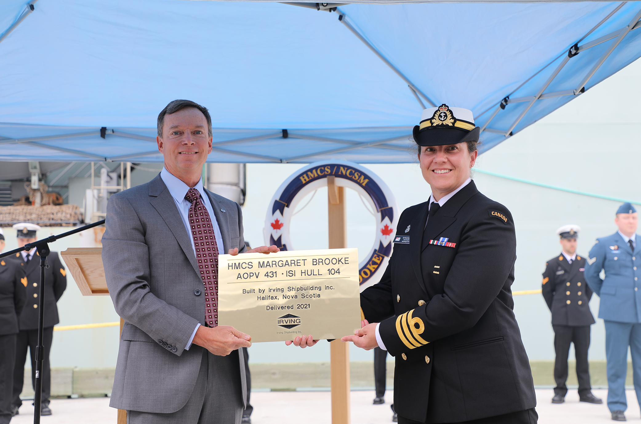 Kevin Mooney presents the Builder’s Plaque to Commander Nicole Robichaud