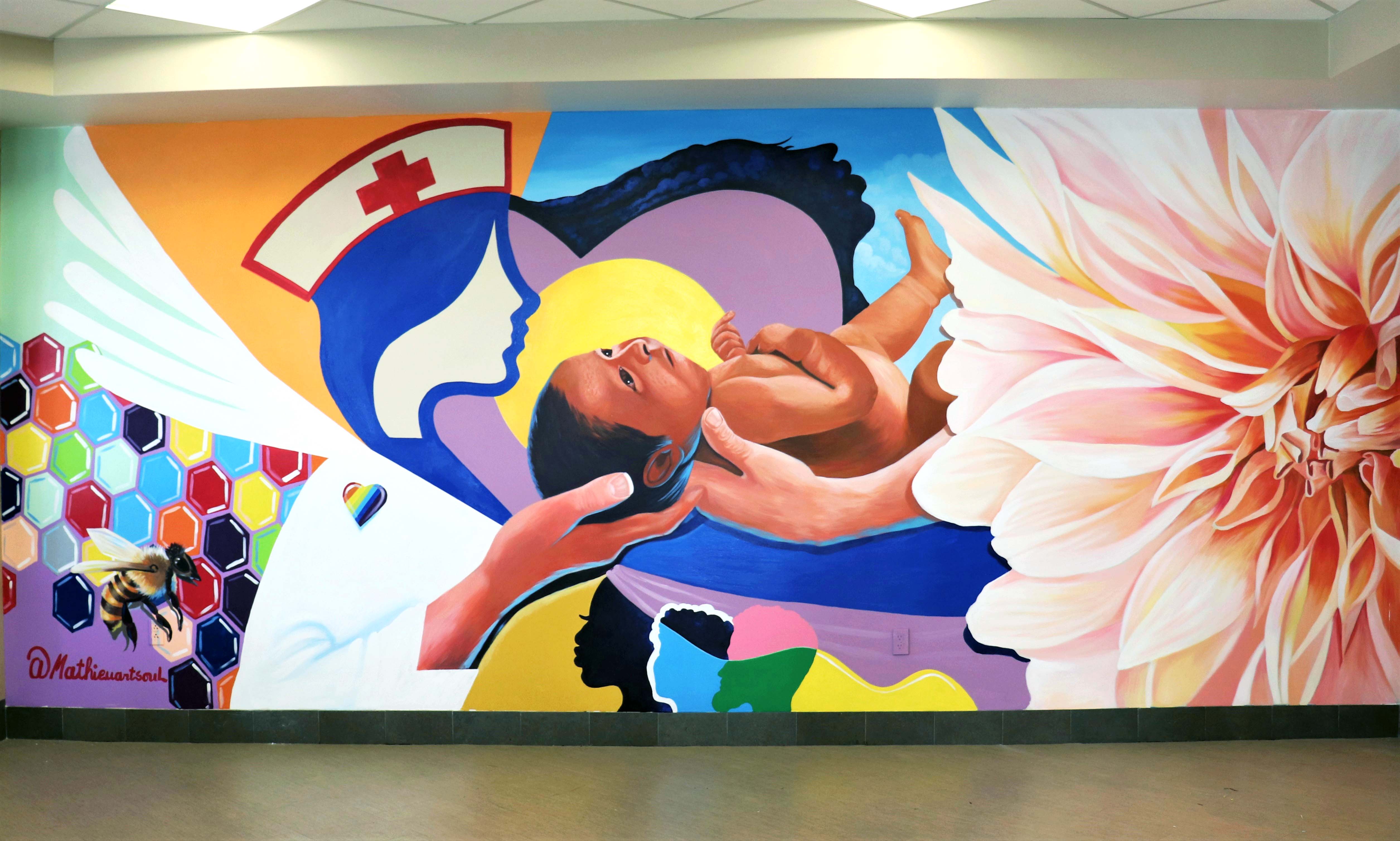 Mathieu Jean Baptiste's mural pays homage to the colleagues of The Woman's Hospital of Texas, who are continuing to provide care during the pandemic. Every aspect of the mural symbolizes different aspects of the hospital. 