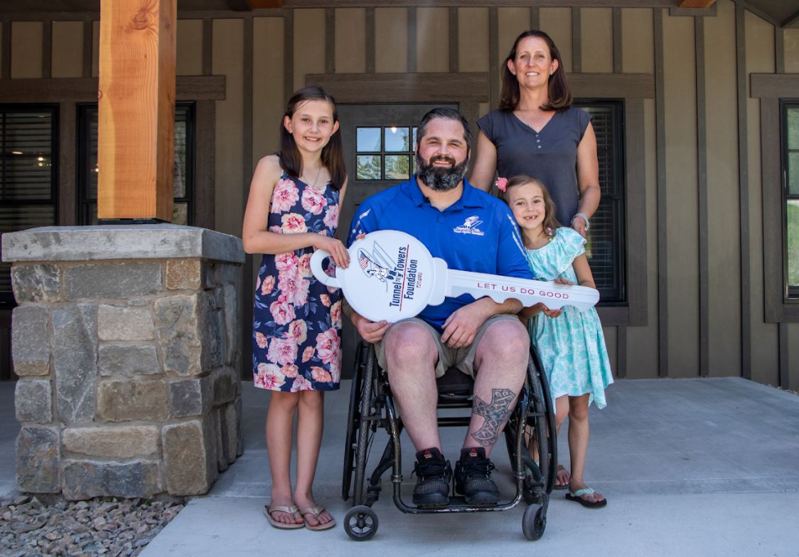 U.S. Navy Senior Chief Petty Officer Austin Reese outside of his brand new mortgage-free smart home