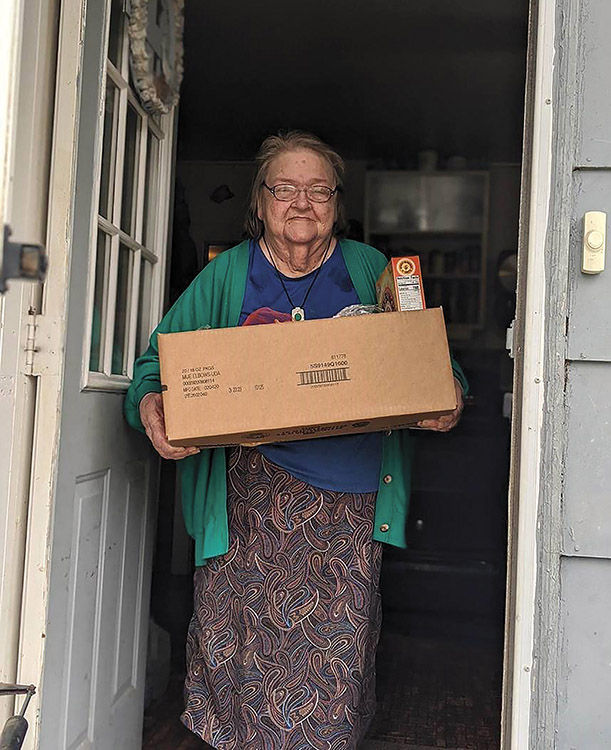 Betty, a widow, receives a food box from Christian Appalachian Project. Without CAP services during the COVID-19 crisis, she said she would have to do without, but at least now she has something to eat. 