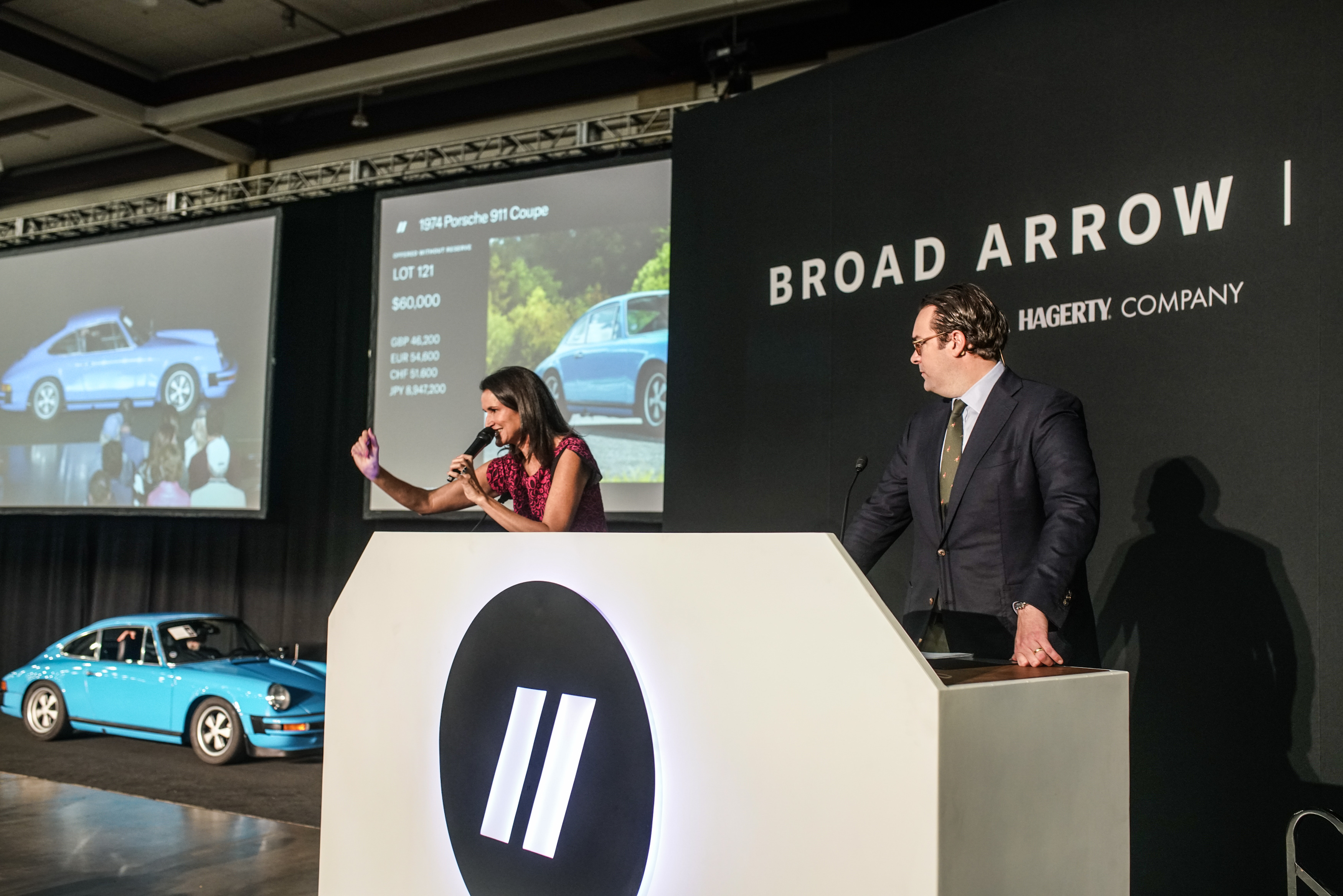 Broad Arrow Principal Auctioneer, Lydia Fenet, and Broad Arrow VP of Operations, Alain Squindo, conduct The Chattanooga Auction during The Chattanooga Motorcar Festival