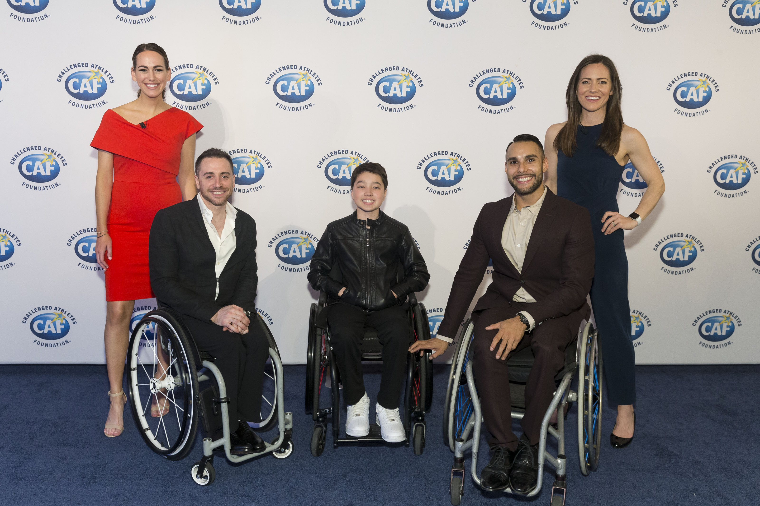 (Left to Right). SF 49ers host Laura Britt poses with Steve Serio, Team USA's Mens Wheelchair Basketball Co-Captian,  Devan Watkins, 12-year-old CAF Grantee from Menlo Park, Jorge Sanchez, Team USA Wheelchair Basketball player and Therese Viñal, SF Giants sportscaster.
