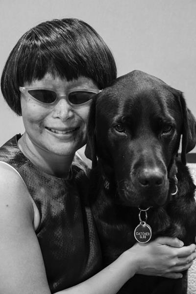 Vivian Chong and her guide dog Catcher