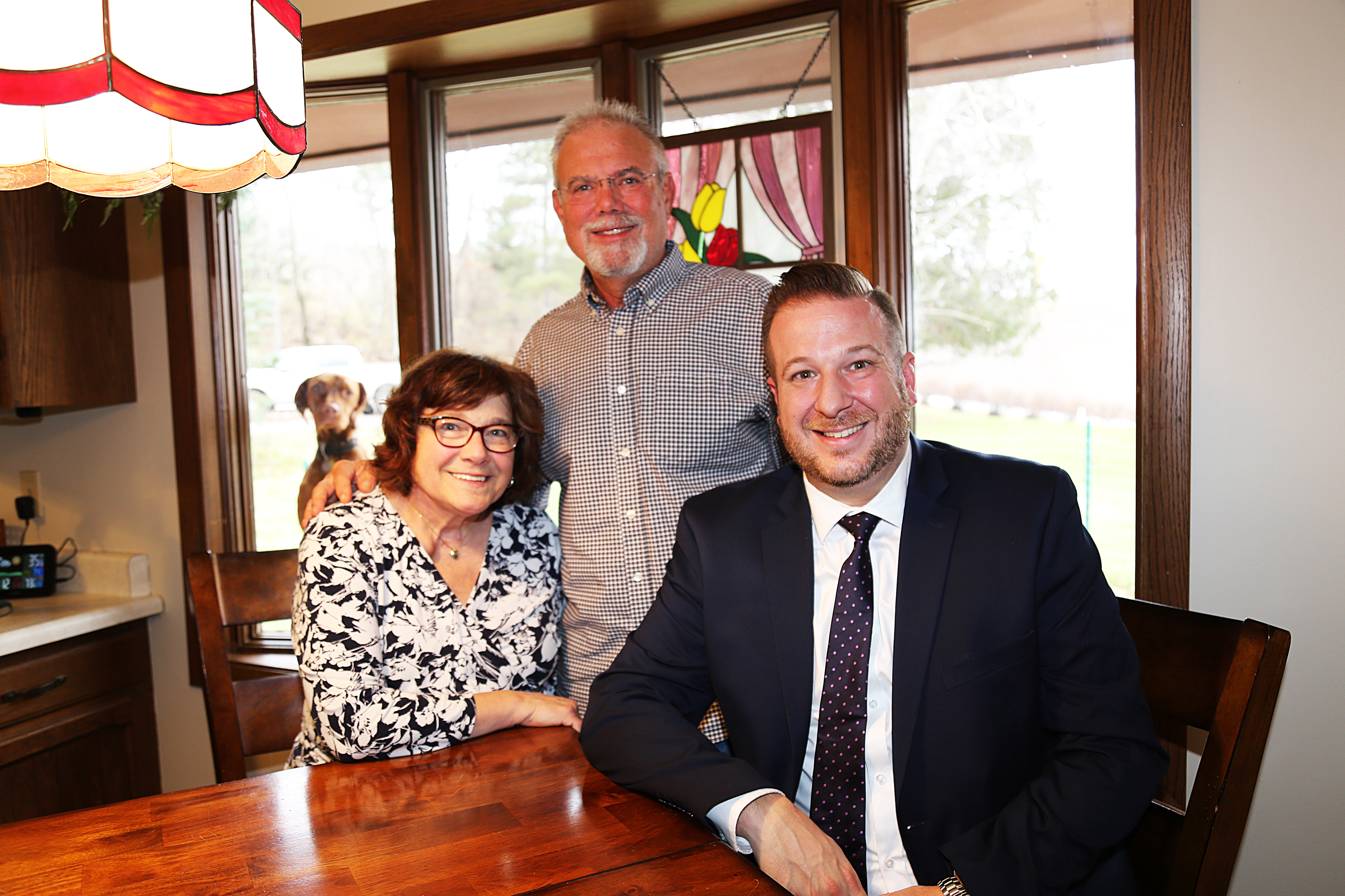 Attorney Vito Manicioto with clients Steve and Ellen Olson who received $4.25 million after a life-threatening crash.