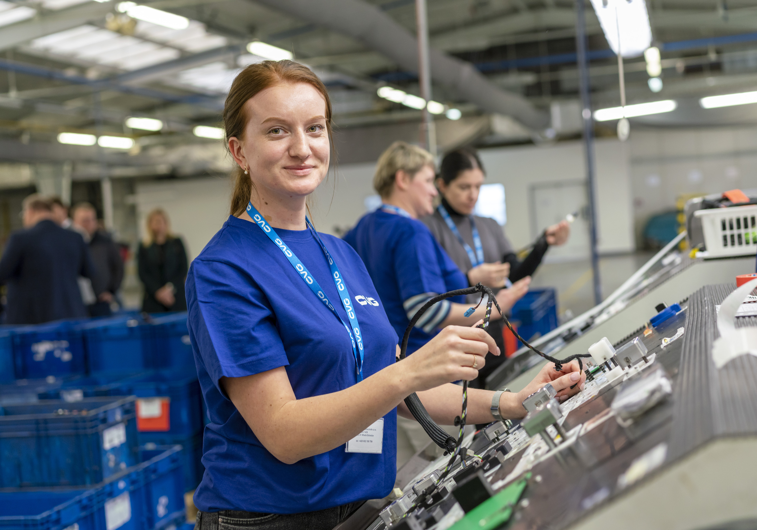 Ukrainian woman from "CVG 35" assembling wire components.