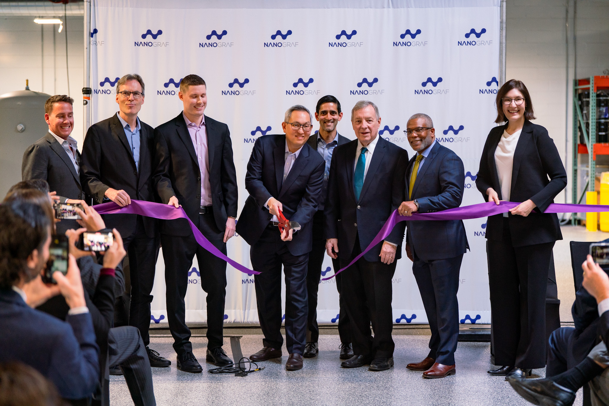 From left to right: NanoGraf President Dr. Kurt (Chip) Breitenkamp; World Business Chicago CEO Michael Fassnacht; NanoGraf COO Connor Hund; NanoGraf CEO Dr. Francis Wang; Polsky Center Managing Director Samir Mayekar; U.S. Senator Dick Durbin; Alderman Walter Burnett Jr. (27th Ward); Illinois Department of Commerce and Economic Opportunity Director Kristin Richards