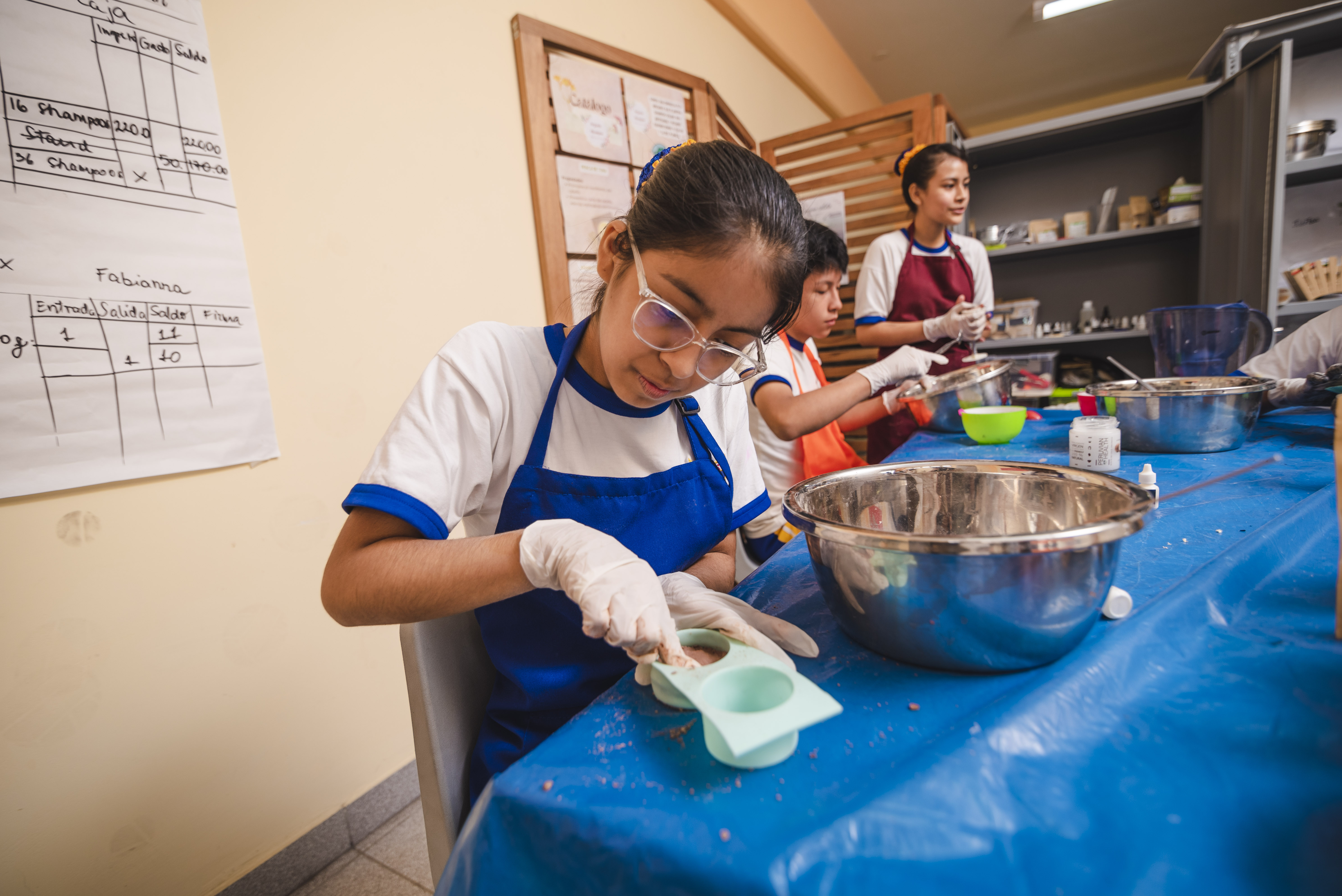 Luciana and classmates start a waste-reducing shampoo business; investing in girls boosts the economy.