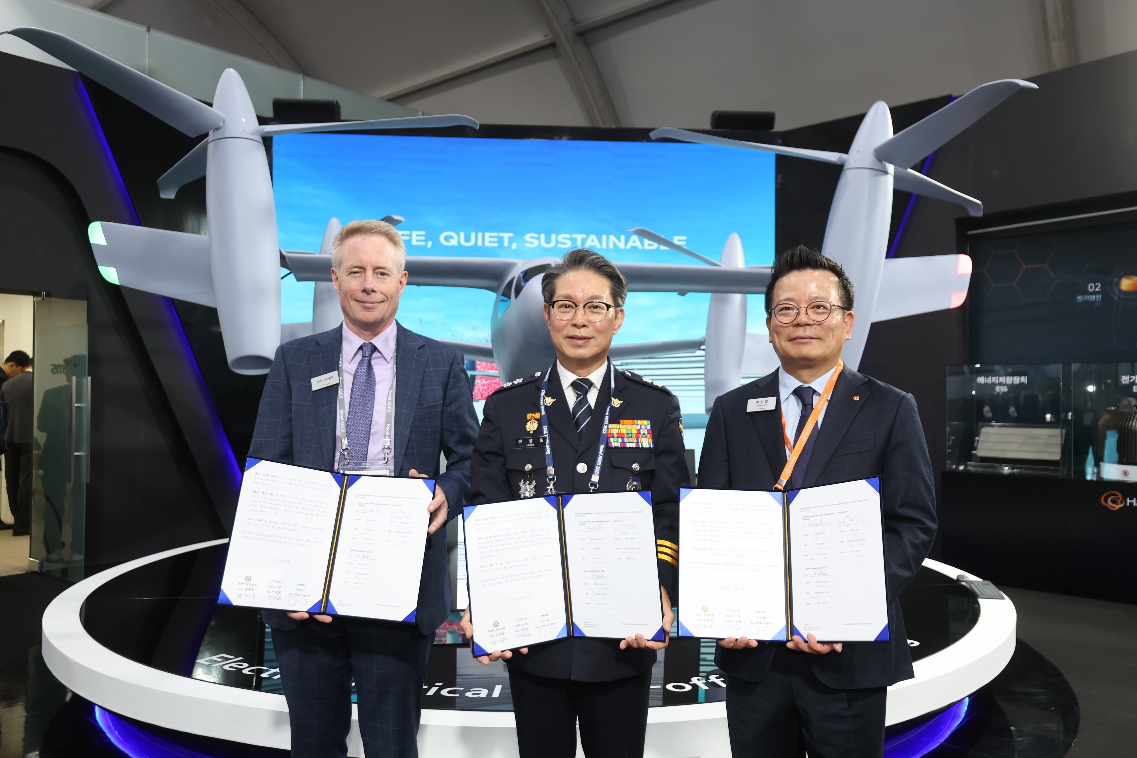Company leadership from Overair, Hanwha Systems and Korean Police stand with MOU
