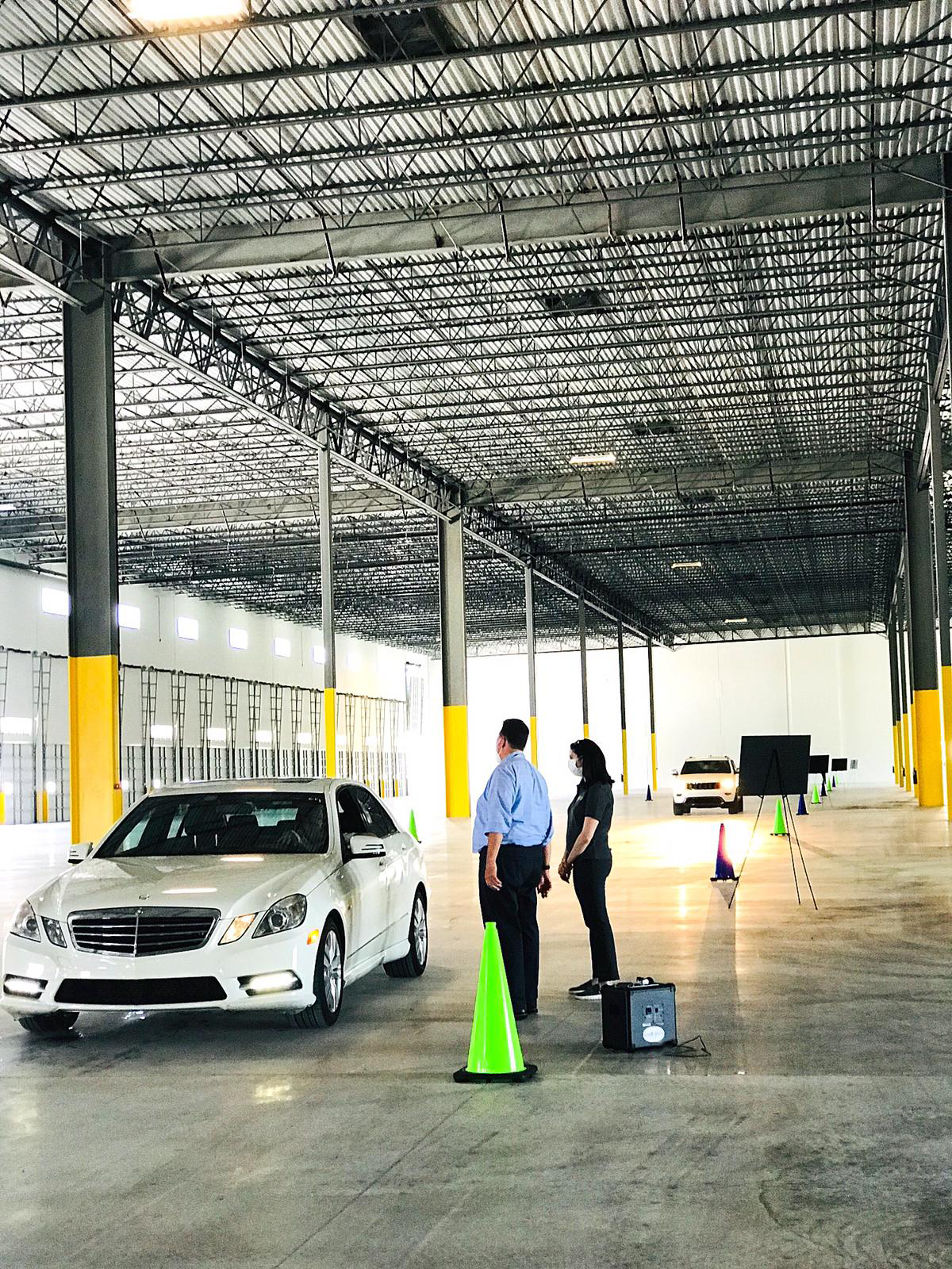 Ana-Marie Codina Barlick, CEO of Codina Partners (developers of Beacon Logistics Park) and Jose I. Juncadella, principal at Fairchild Partners (leasing company for Beacon Logistics Park) discuss the details of the Building F at the industrial park with brokers at the recent caravan broker event.

 