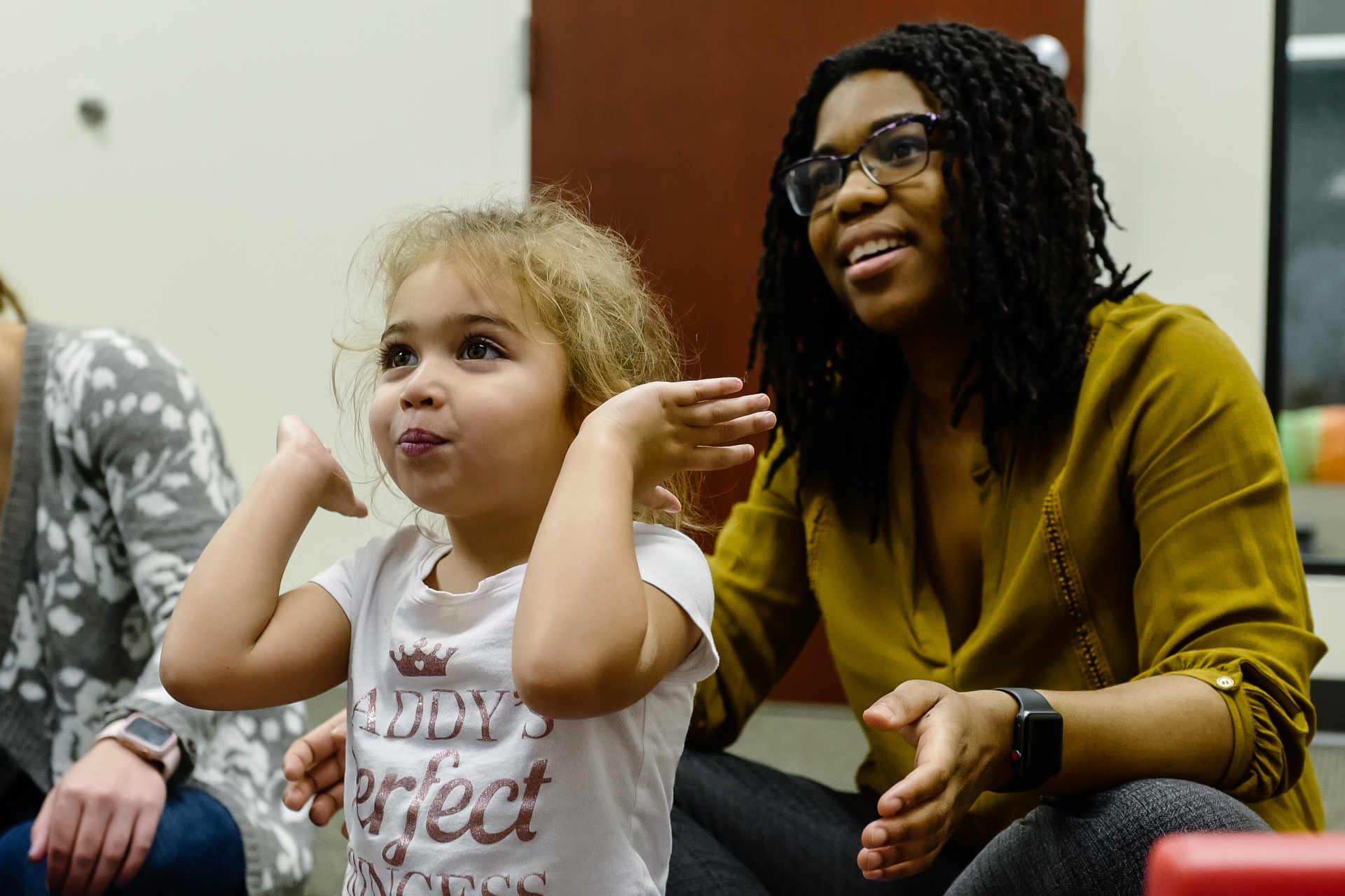 A member of InBloom's clinical team works on social and group skills with a client at one of InBloom's Learning Centers.