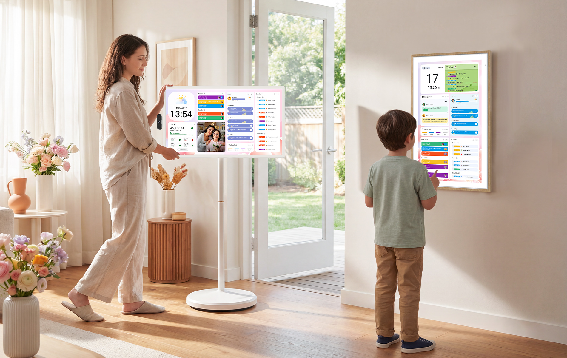 Digital calendar showing family plans as a child views schedules and a mother rolls portable TV in the living room