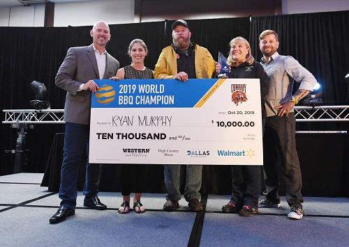 Ryan Murphy receives winning check for the 2019 World Barbecue Champion title.