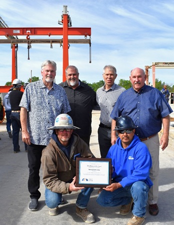 From top left to bottom right: Ronald A. Hamm, President; Shane Rawson, Precast Estimator; Knox Ross, Director of Infrastructure Projects; Carl Hall, Vice President and Director of Precast; Paul Adams, Production Supervisor, Plant Operations; and Arlo Maldonado, Layout Foreman, pictured together at the Speed Fab-Crete precast facility in Kennedale, Texas, accepting the 2025 NPCA Platinum Safety Award on behalf of the team.