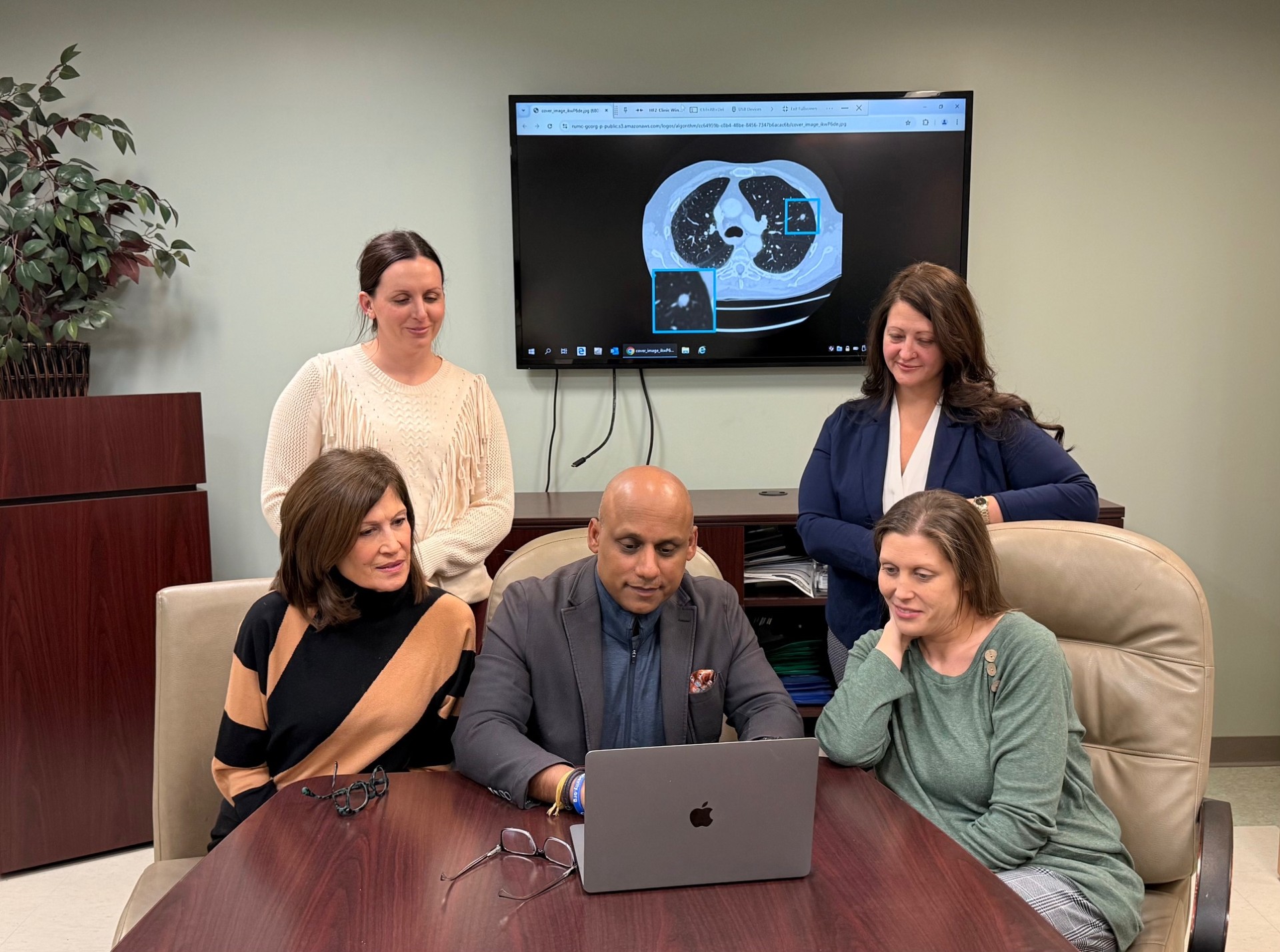 Sandeep Bansal, MD, FCCP, FACP, Medical Director of The Lung Center and Interventional Pulmonology at Penn Highlands Healthcare (center) is shown with (from upper left clockwise) Savannah Shirley, Navigator; Dawn Jeannerat, AGACNP-BC, Acute Care Nurse Practitioner; Amber Witherow, Navigator; and Candace Cole, Navigator.