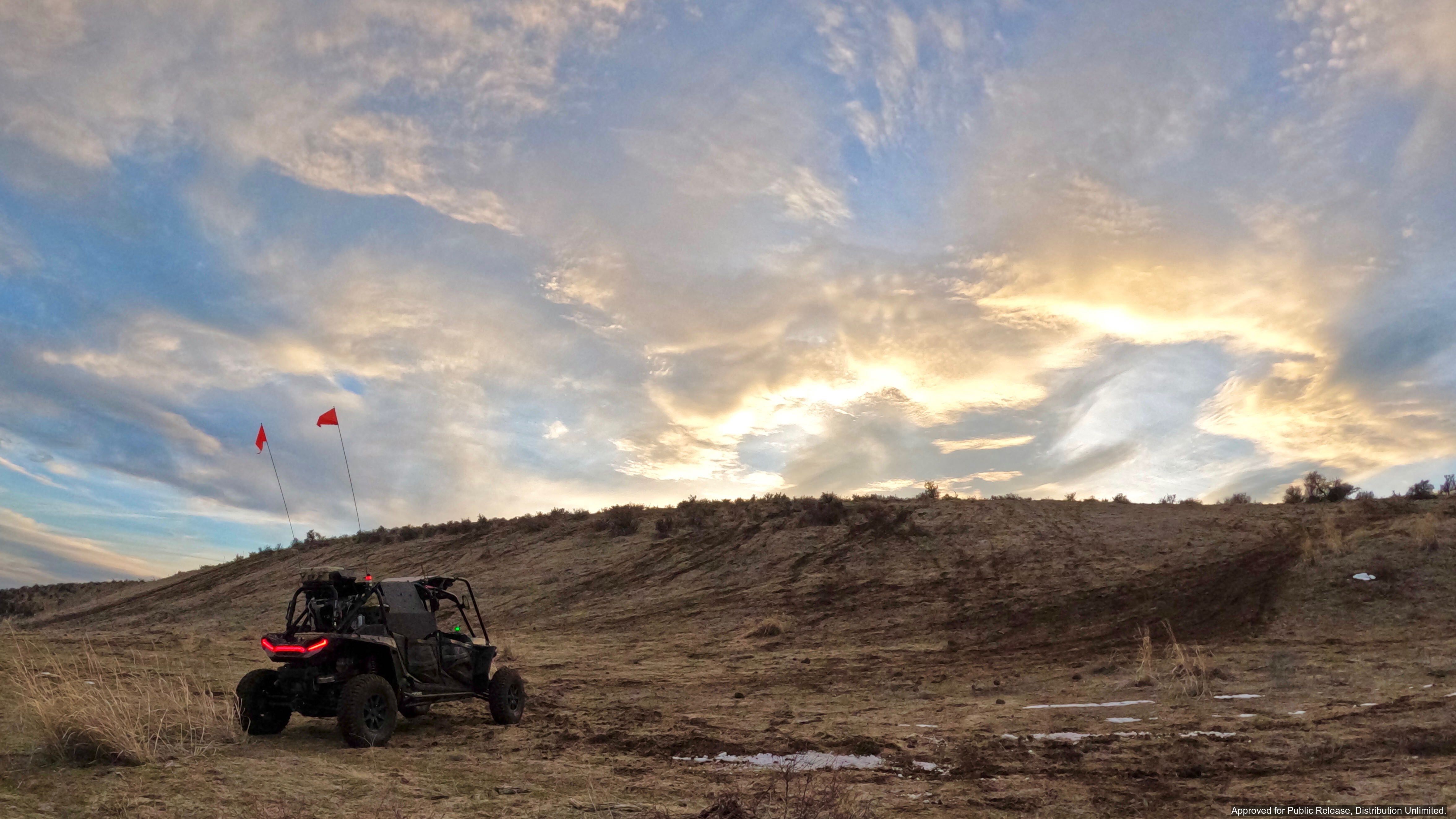 Overland AI’s OverDrive is a mature and proven software product that can be installed in any vehicle so it can autonomously navigate off-road terrain. Unlike other self-driving systems that only operate on highways and dirt roads, OverDrive can navigate through rugged terrain, including complex off-road terrain and topography without trails. It can also contend with a wide variety of difficult conditions, including sand, brush, ice, mud, etc., at operationally-relevant speeds. OverDrive can operate in any rugged and contested environment, including areas with limited or no communications. OverDrive uses passive sensors to avoid detection and doesn’t need pre-mapped routes since it uses on-board sensors to interpret the surrounding terrain in real time. Service members and users can leverage OverDrive to remotely summon an OverDrive-powered vehicle from miles away without defining the path.