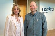 Launi Skinner, CEO at First West Credit Union and Dan Huang-Taylor, Executive Director at Food Banks BC pose together for a photo following the $100,000 donation announcement.