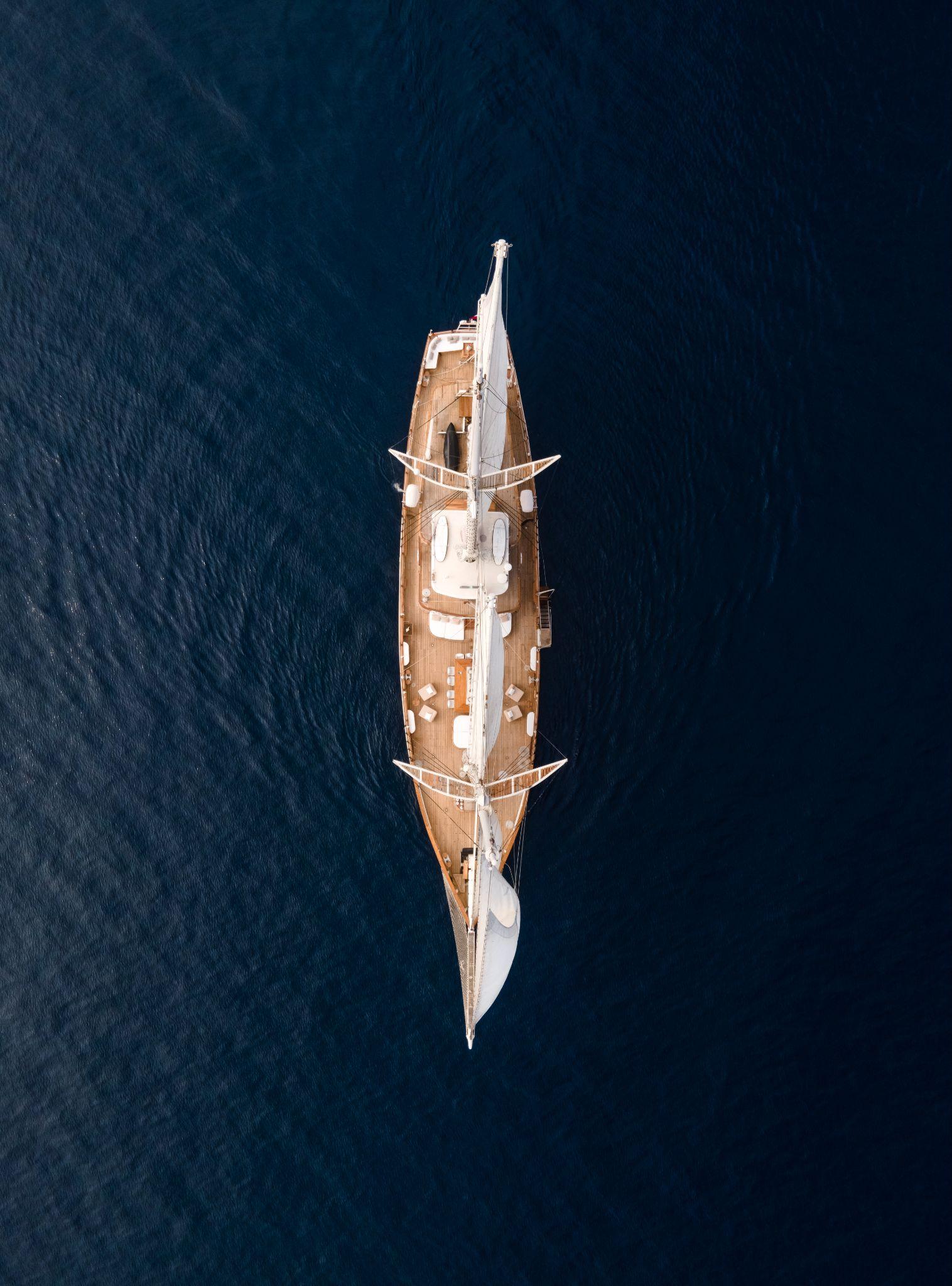 Aerial view of a luxury private charter yacht offered by Navélia Yacht Charters in Indonesia.