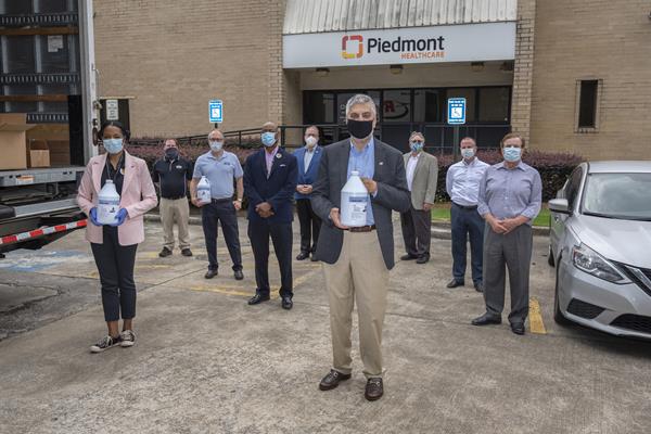 The team involved with the formulation, production, and delivery of Han-I-Size White & Gold makes a delivery to Piedmont Hospital in Atlanta.