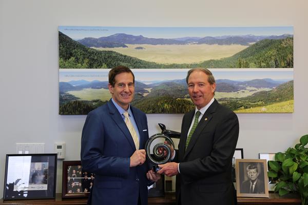 John Schall, CEO of Caregiver Action Network, presents the 2019 Caregiving Leader in Congress Award to U.S. Senator Tom Udall (D-NM).