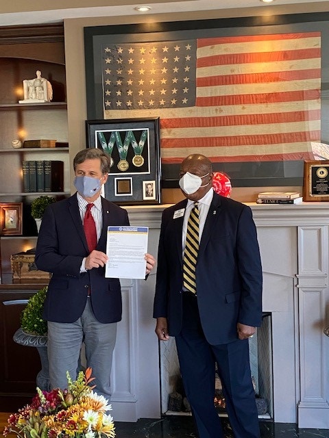 Lions Clubs International First Vice President Douglas X. Alexander (right) presented Dr. Timothy Shriver (left) with the Lions Clubs International Foundation Melvin Jones Fellowship (MJF) recognition and thanked him for his Lions service and continued support of programs born from the long-standing Special Olympics-LCIF partnership.