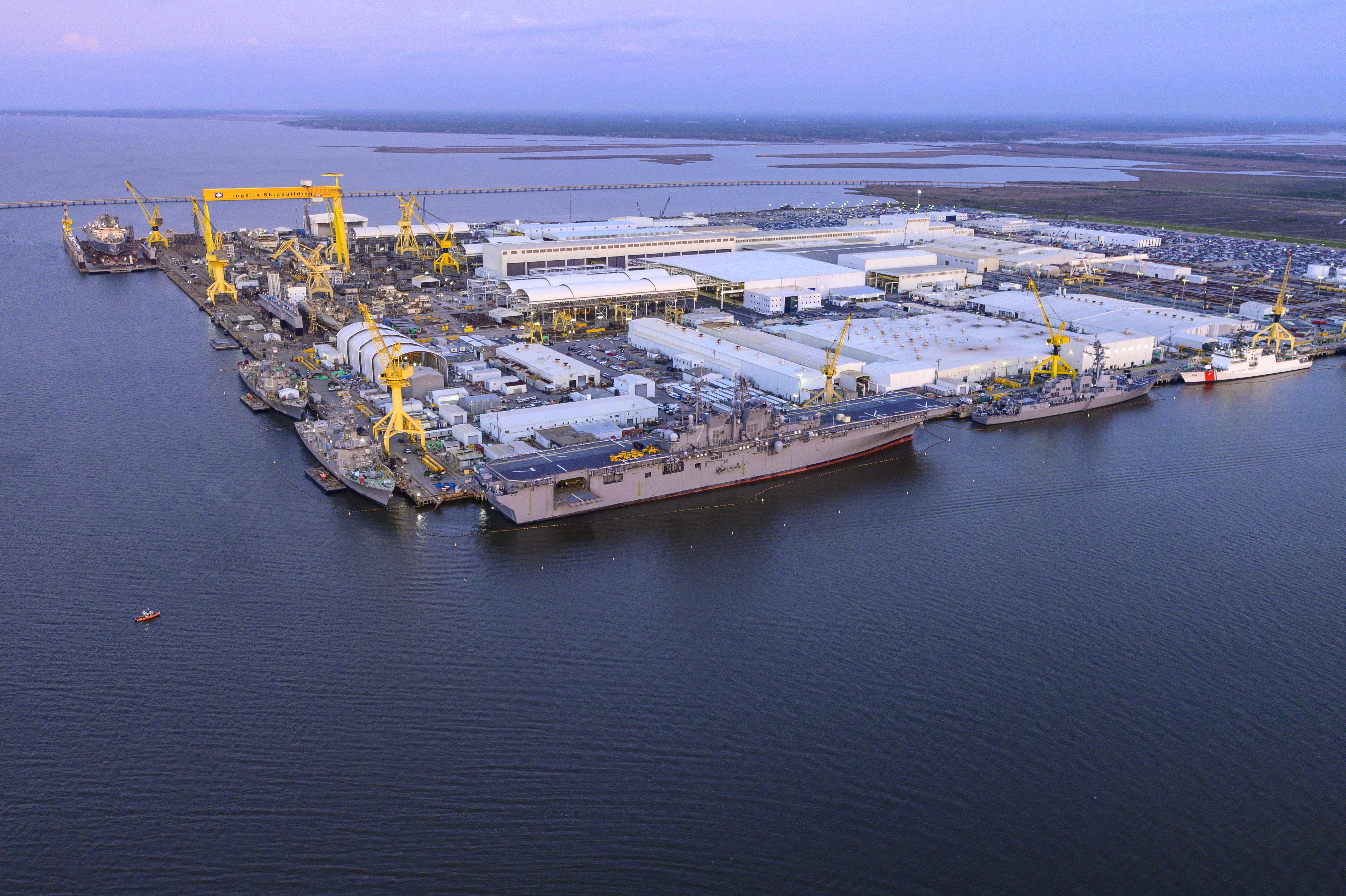Aerial image of HII’s Ingalls Shipbuilding. Ingalls was awarded a design engineering contract from the Navy for the Next-Generation Guided-Missile Destroyer (DDG(X)) program. Ingalls has delivered 33 destroyers to the U.S. navy, with five more currently under construction. Ingalls is working with the Navy to keep the destroyer line strong as the Navy transitions to the next generation of guided missile destroyers.