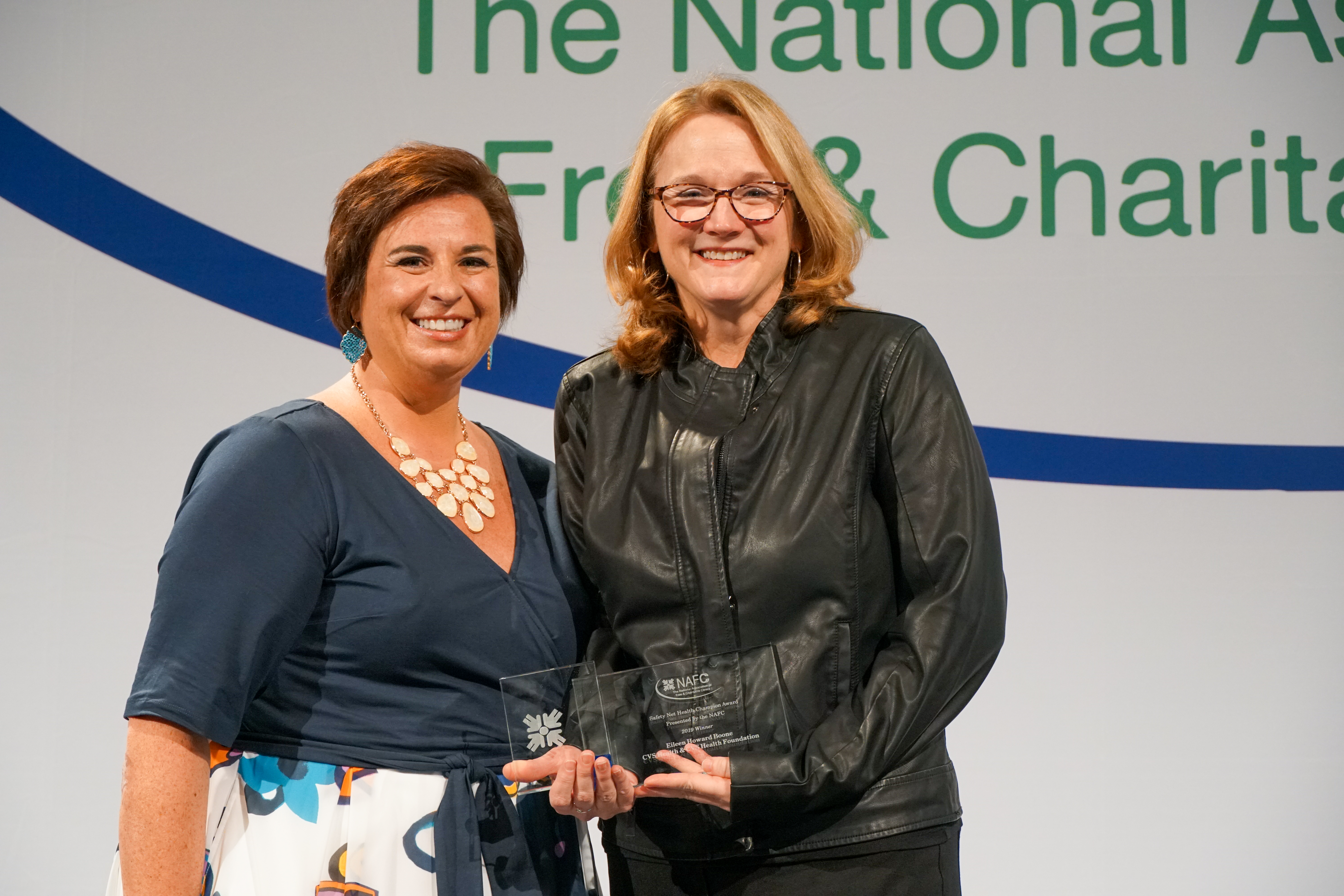 Nicole Lamoureux, NAFC President and Chief Executive Officer presents Eileen Howard Boone, Senior Vice President of Corporate Social Responsibility and Philanthropy for CVS Health and President of the CVS Health Foundation with the NAFC 2019 Safety Net Health Care Champion Award.