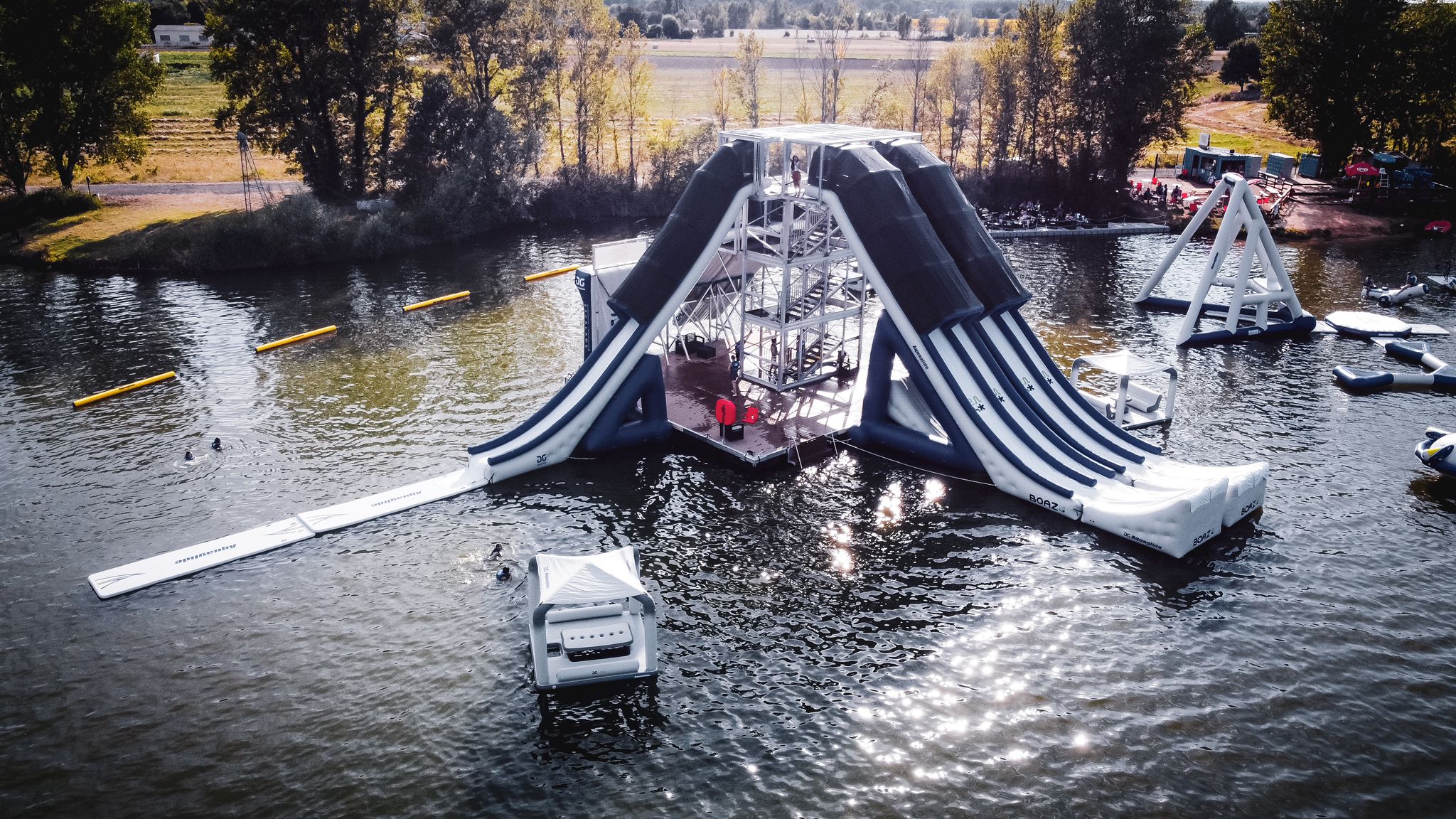 Aerial view of XTower with runout and kicker slides on the water.