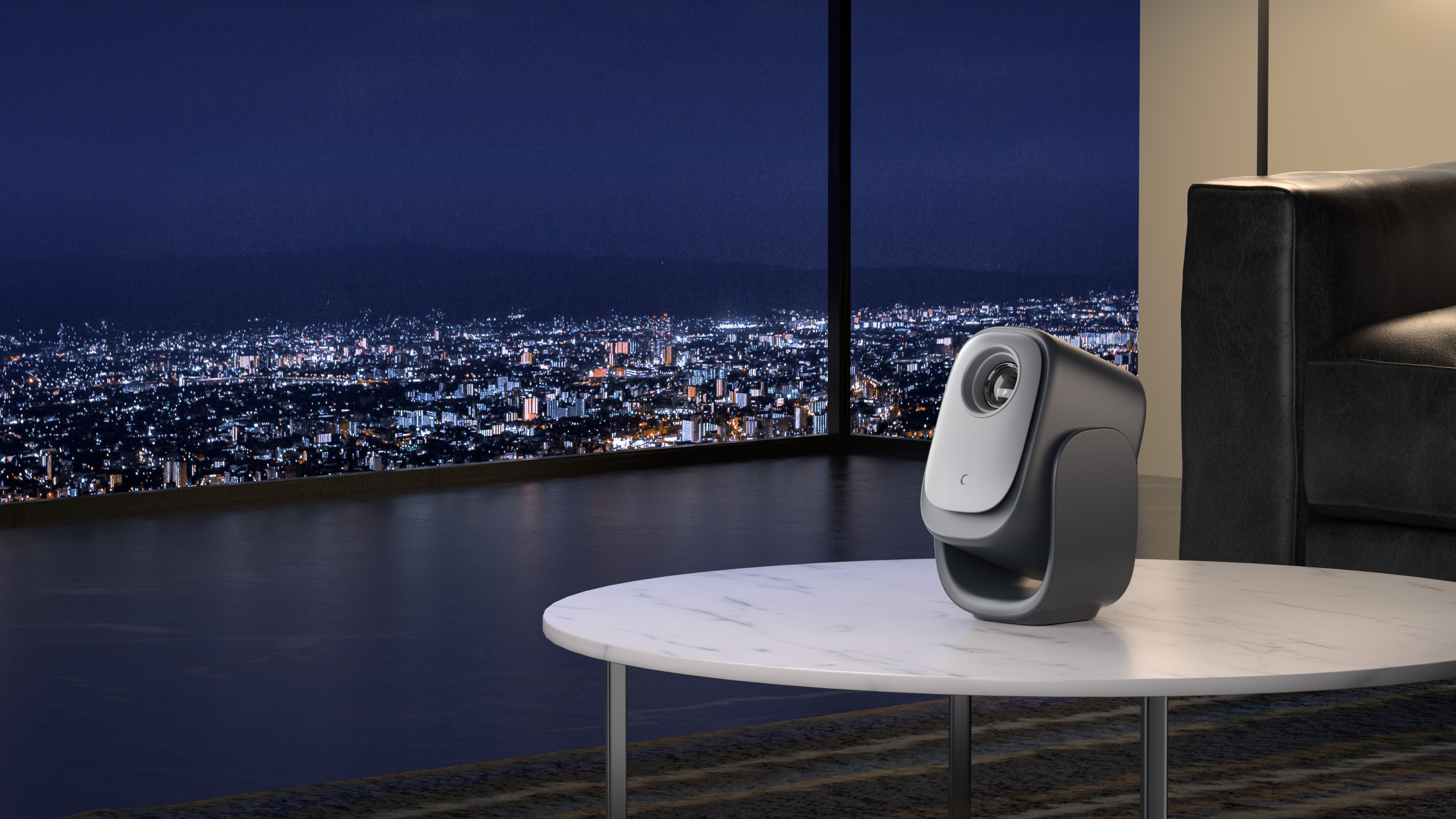 Compact Dangbei N2 mini 1080p projector on a table beside a window with a city skyline at night.