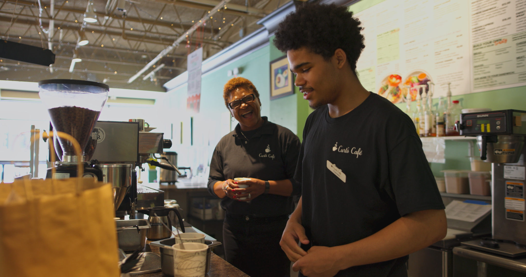 Curt's Cafe Executive Director Tanya Jenkins and a student