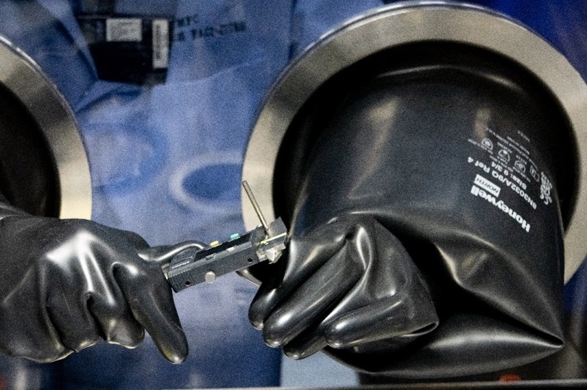 Taking dimensional measurements of a finished enriched uranium-zirconium coupon sample