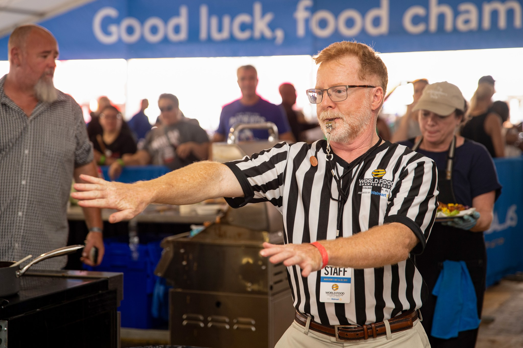 Cheferee clearing the turn-in area at the 8th annual World Food Championships in Dallas, Texas.