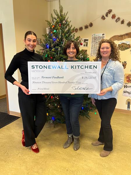 Stonewall Kitchen and Vermont Coffee Company Representatives present Vermont Food Bank with donation check for over $19,000