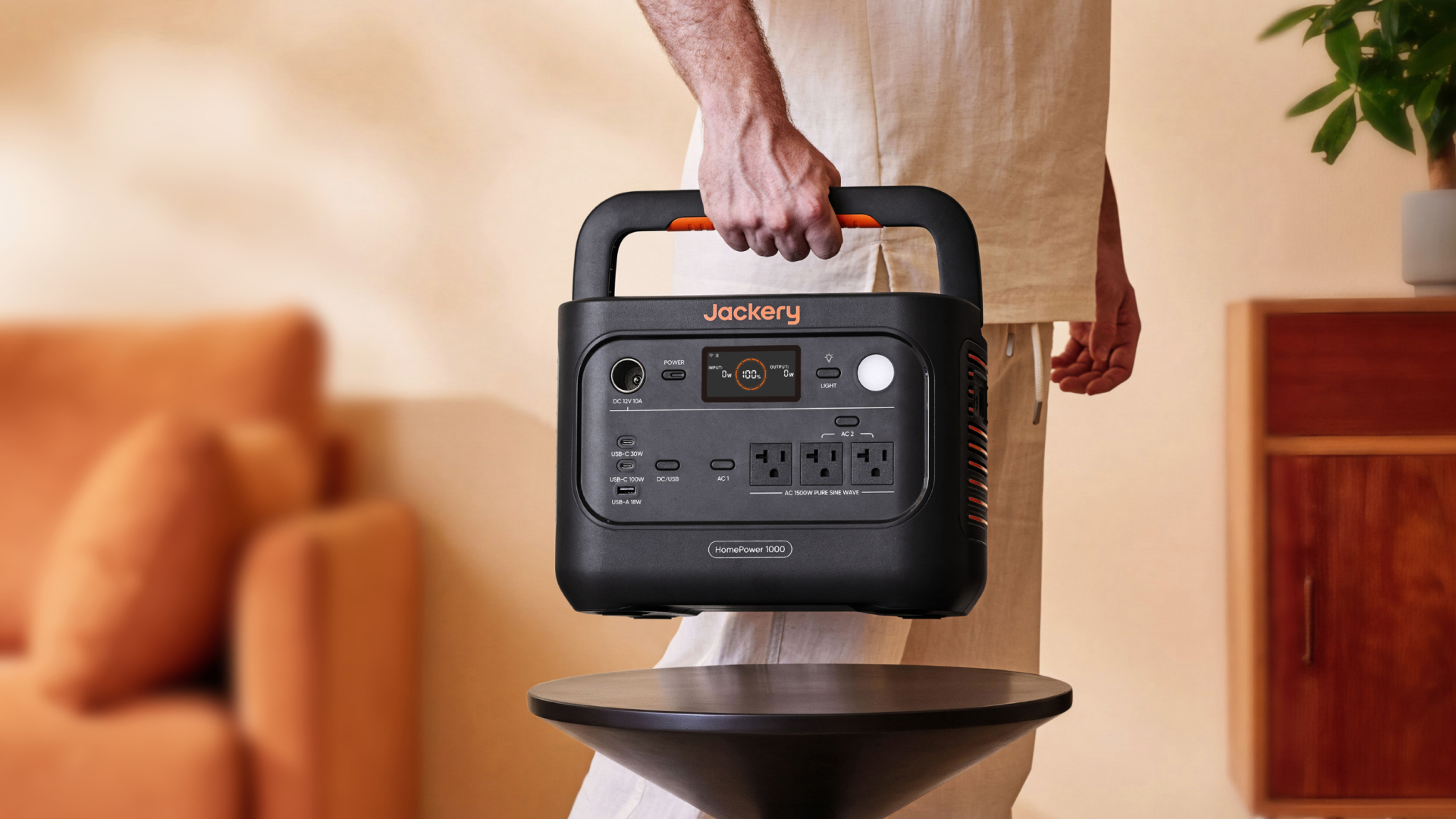 Man carrying lightweight Jackery HomePower 1000 v2 power station indoors
