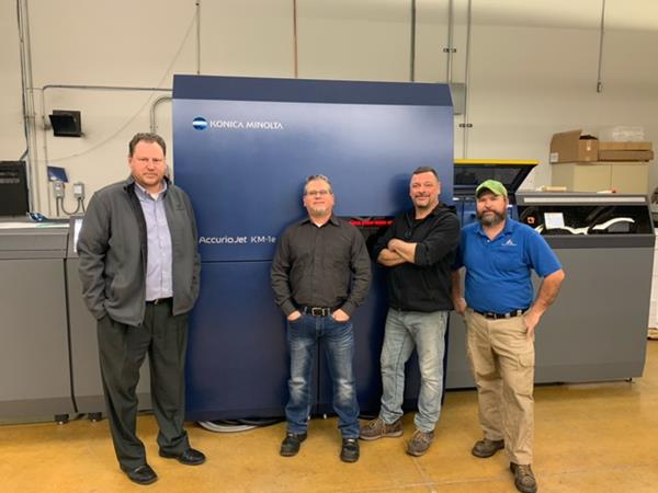 The Vomela Companies recently installed Konica Minolta’s AccurioJet KM-1e LED UV Inkjet Press at its Elk Grove, IL production location. L-R: Glen Hoffmann, General Manager; Todd Mason, Director of Operations; Jim Munoz, KM-1e Operator; Chris Snyder, KM-1e Operator