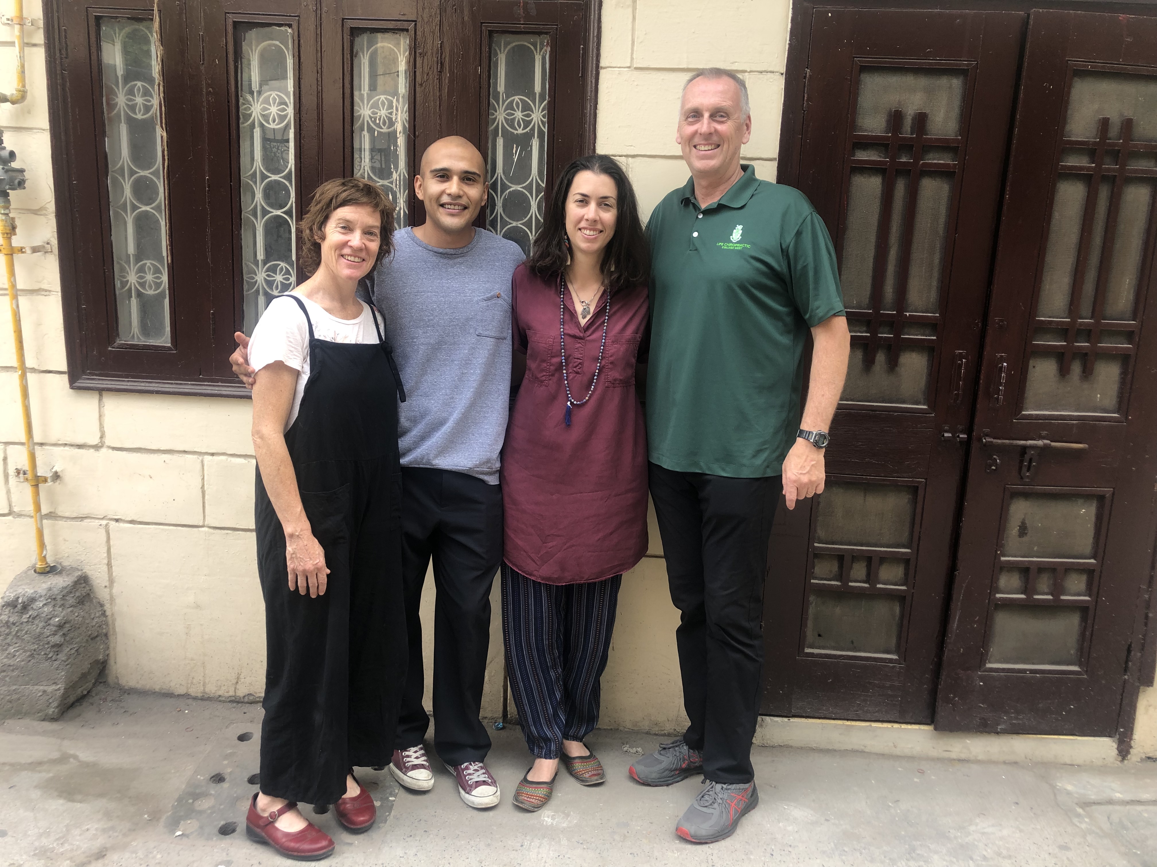 Faculty members from Life Chiropractic College West pose in front of the new India clinic that Life West opened in July 2019. Thousands have come through the doors since its opening, and soon, Life West interns will be able to serve at the clinic in 3-month preceptorships. 