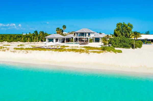 Beachfront villa for rent by the week in the Turks & Caicos islands of the Caribbean, which includes WIMCO Villas' 24/7 concierge services. One of the approximately 2,000 private villas represented by WIMCO.