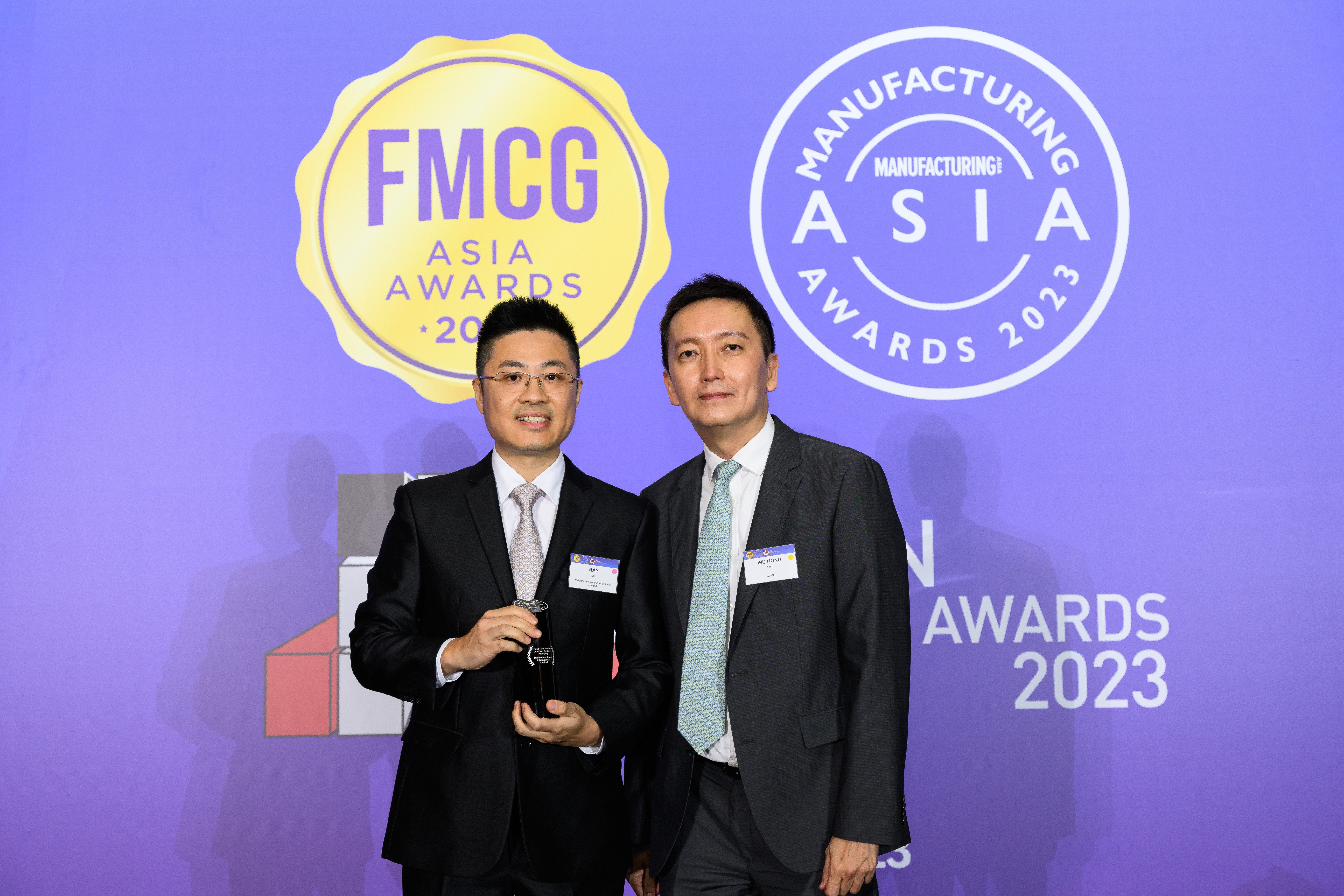 Ray Lai (on the left), on behalf of Millennium Group, accepts the award