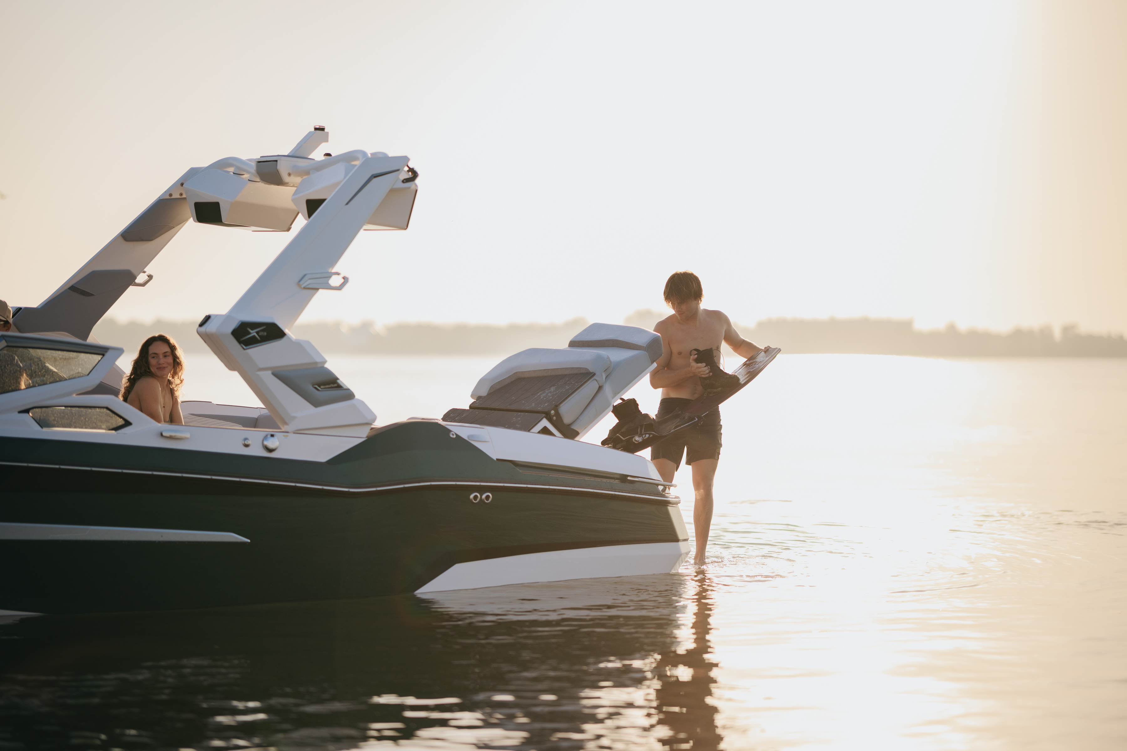 Wakeboarder utilizing transom storage. 